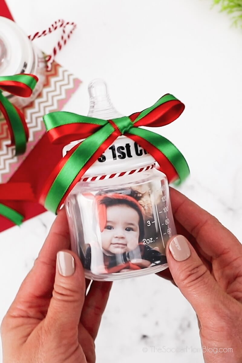 holding a homemade baby bottle ornament