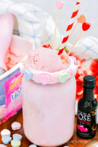 strawberry milkshake in mason jar with conversation heart rim