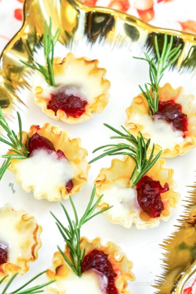 Cranberry Brie Bites with green garnish