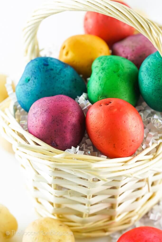 basket full of potatoes dyed like Easter eggs