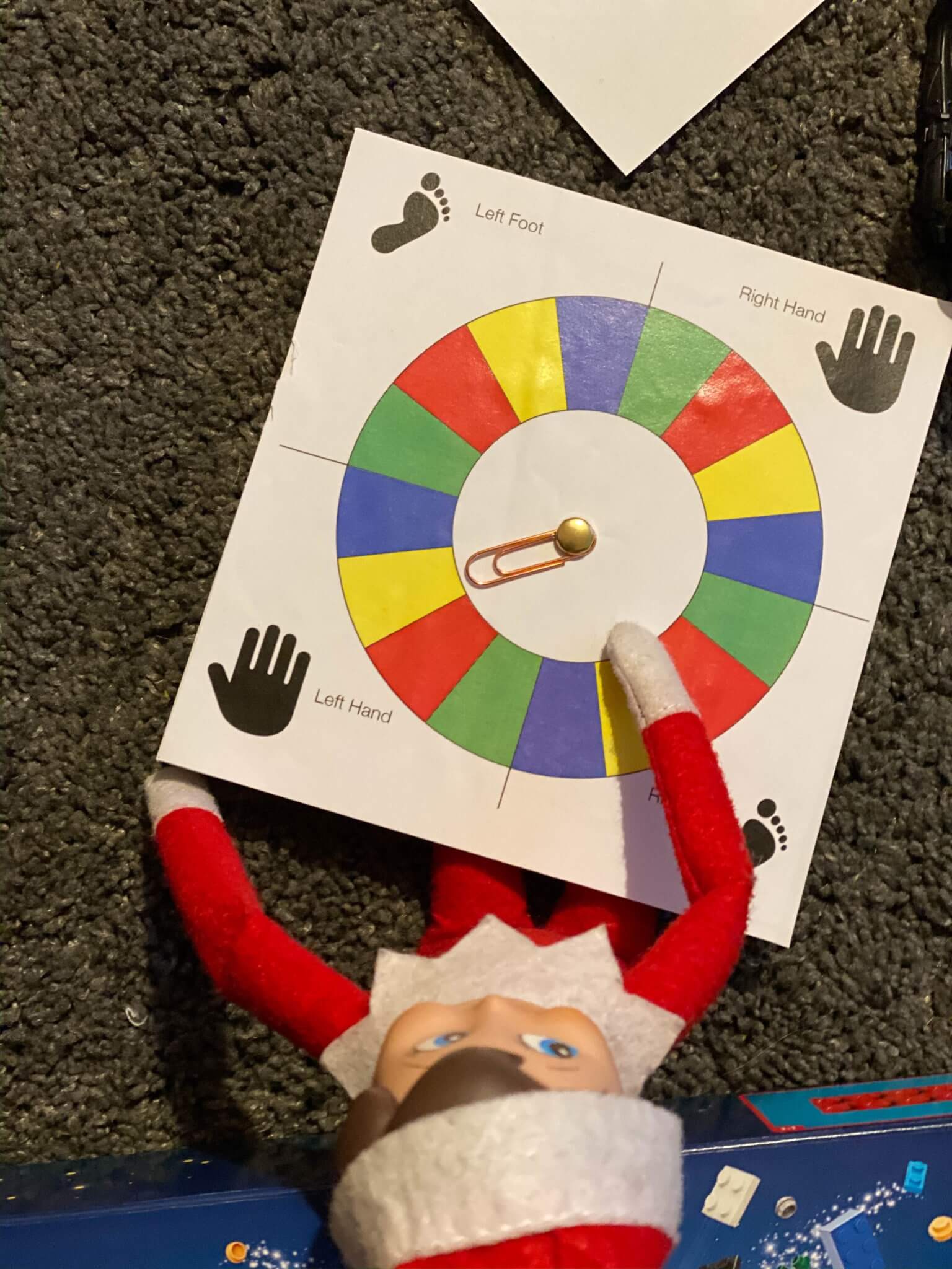 Elf on the Shelf doll playing Twister