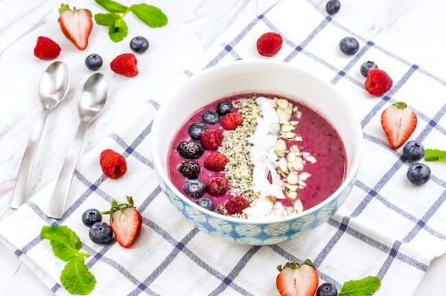 A vibrant blend of three berries and protein-rich ingredients, this Triple Berry Smoothie Bowl is a nutritional powerhouse!