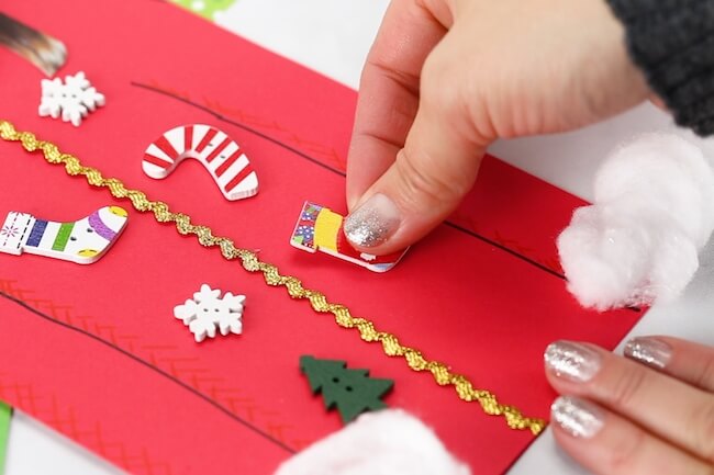 It may be called "ugly" but this Ugly Sweater Christmas Card is one of the CUTEST kid-made Christmas card ideas ever! And it's super easy to make!