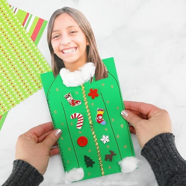 It may be called "ugly" but this Ugly Sweater Christmas Card is one of the CUTEST kid-made Christmas card ideas ever! And it's super easy to make!