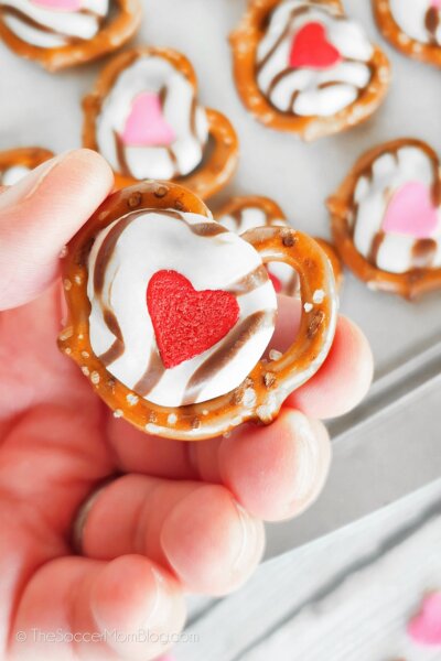 holding a Valentine heart pretzel treat