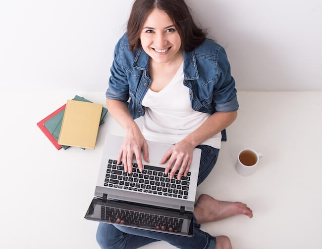 mom blogger on laptop smiling